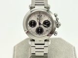 a silver watch with a white face on a display stand