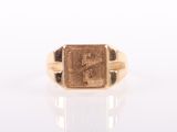 a close up of a gold ring with a roman numeral on it