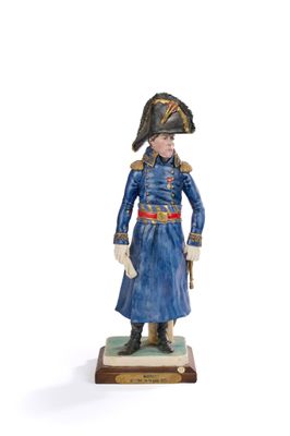 figurine représentant un homme en uniforme bleu, coiffé d'un chapeau et chaussé de bottes