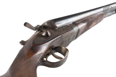 un gros plan d'un pistolet sur un fond blanc avec un fond blanc