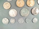 a lot of coins that are on the table