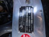 a close up of a motorcycle engine with a sticker on it