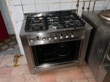 a stainless steel stove and oven in a kitchen