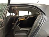 a car with the door open and the passenger seat down