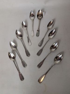 a lot of spoons arranged in a circle on the table