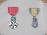 a picture of a picture of two medals in a frame
