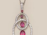 a pink tourmaline and diamond pendant on a chain