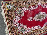 two rugs on the ground with one red and the other blue