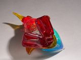 a glass bird that is sitting on a table