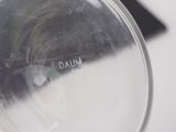 a close up of a glass with a liquid inside of it
