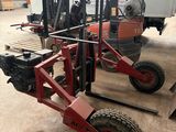 two forklifts are parked next to each other in a warehouse