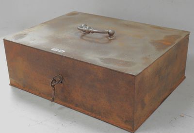 a metal box with a lock on it on a white surface