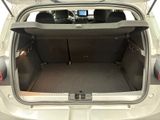the back of a car with the trunk open and the back seats down