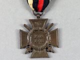 three medals and a medal on a white surface