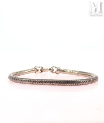 a close up of a bracelet on a white background