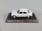 a white model of a car on display on a table