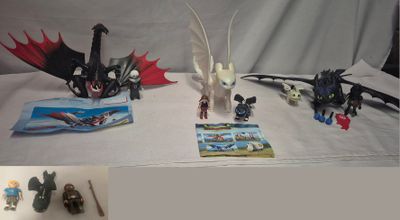 a picture of a table with legos and dragon figurines on it