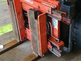 a forklift with a large load on it in a warehouse