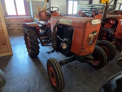 a tractor that is sitting in a garage