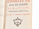 an open book with a picture of a clock on the cover