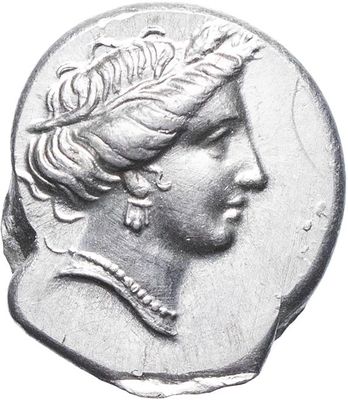 a close up of a coin with a woman ' s head on it