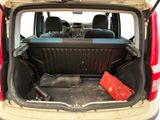 the back of a car with the trunk open and a tool bag in the trunk