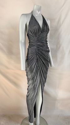 a mannequin wearing a grey dress on a white mannequin
