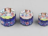 three pieces of cloise glass with a picture of people in a garden