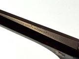 a close up of a pair of scissors on a white surface