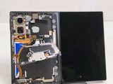 a laptop with a broken screen sitting on a table
