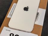 an apple iphone is sitting on top of a box on a table