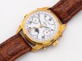 a close up of a watch on a brown strap on a white surface