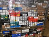 a metal cart with many boxes on it in a warehouse