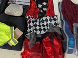 a pile of clothing and other items on the floor