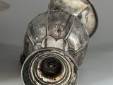 a silver object that is sitting on a table