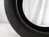 a close up of a tire on a white surface
