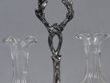 three glass vases on a silver tray with a silver handle