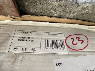 a box with a red stamp on it and a barcode on it