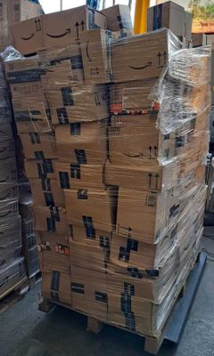 a large stack of boxes sitting on top of a pallet