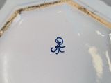 a white plate with a blue design on it