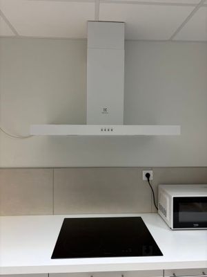 an image of a kitchen with a microwave and a stove