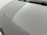 a close up of a car ' s hood with the hood down