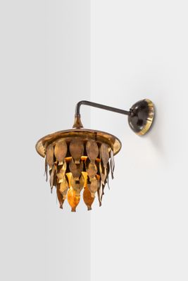 a light that is on the wall next to a wall