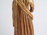 an old statue of a man with a beard and a robe