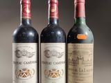 three bottles of wine sitting on top of a table next to each other