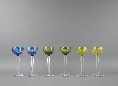 six different colored wine glasses lined up in a row