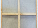 a close up of an old window frame with a window pane in it