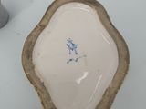 a white plate with a blue and white design on it