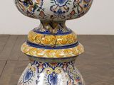a vase that is sitting on top of a wooden table