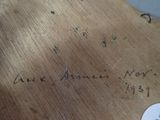 a piece of wood that has writing on it